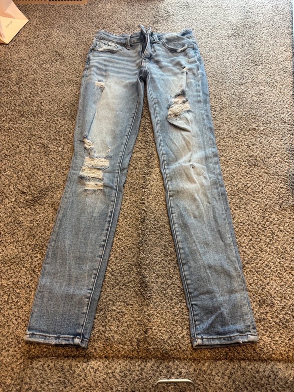 Buckle black skinny jeans